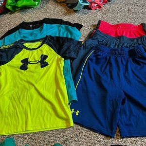 4 pairs Nike(size 7) and Under Armour (size 6) shorts and shirts